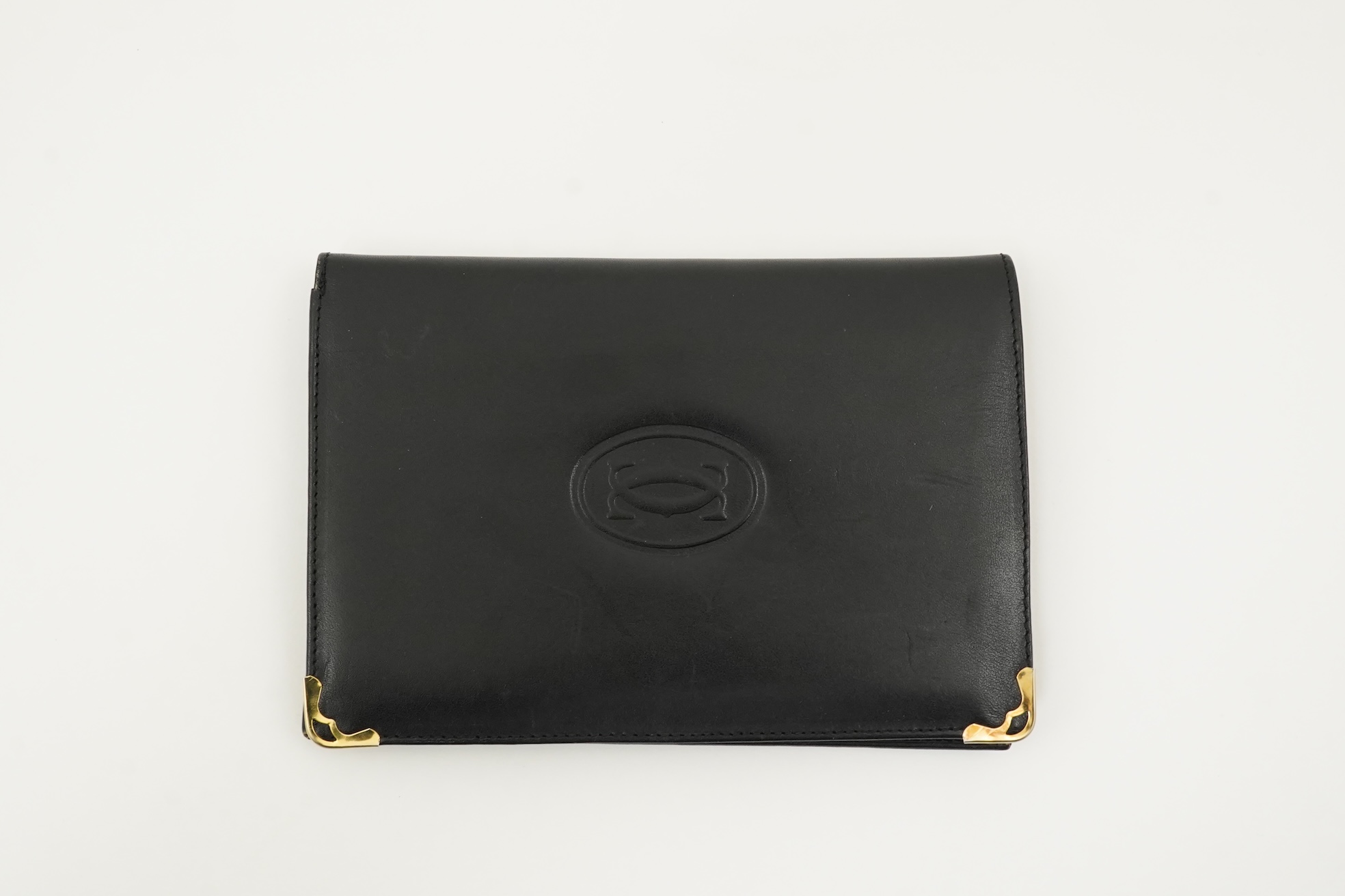 A gentleman's black Cartier wallet